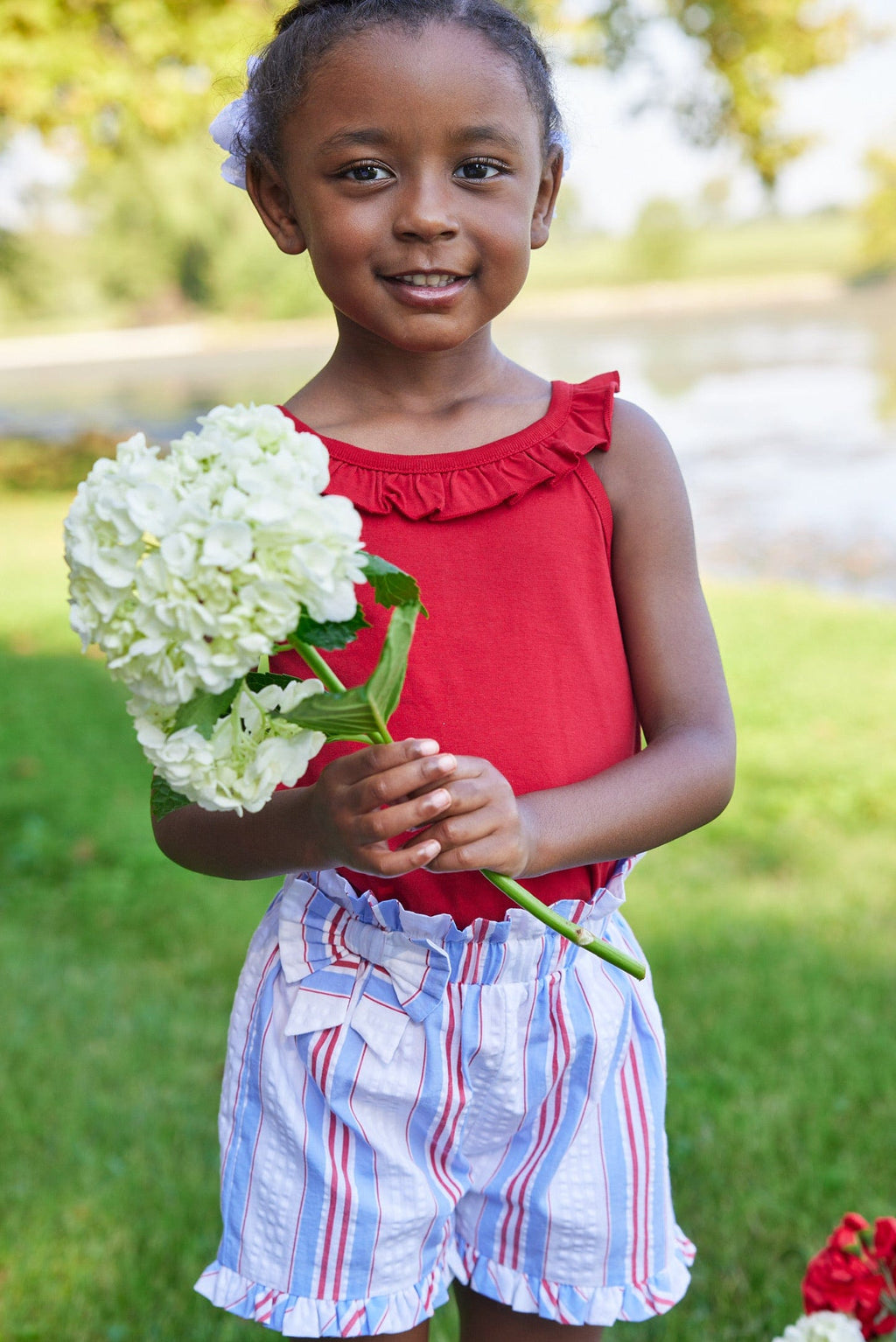 Little English traditional children's clothing.  Red, white and blue striped seersucker shorts for girls for Summer.  4th of July shorts for girls