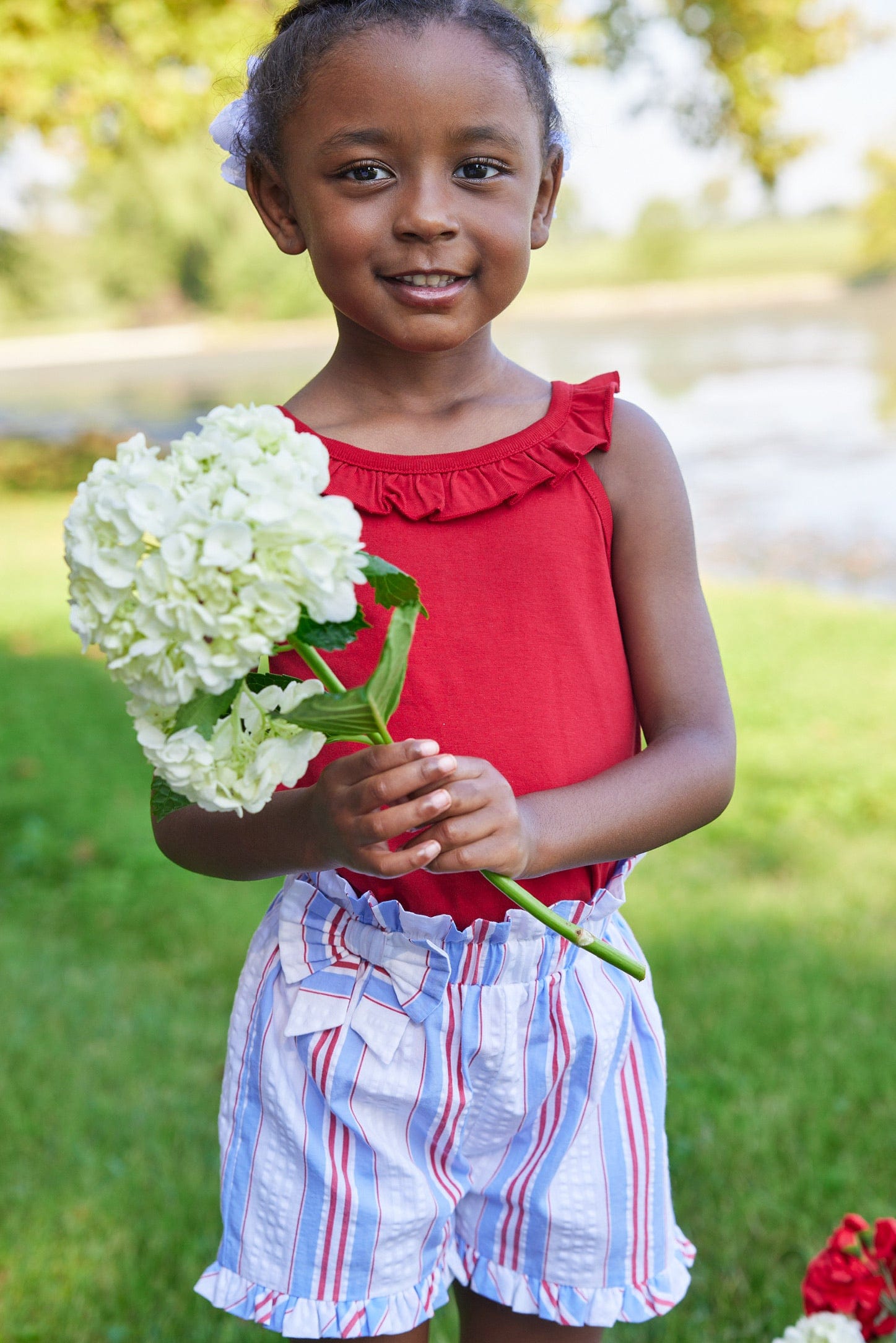 Little English traditional children's clothing.  Red, white and blue striped seersucker shorts for girls for Summer.  4th of July shorts for girls