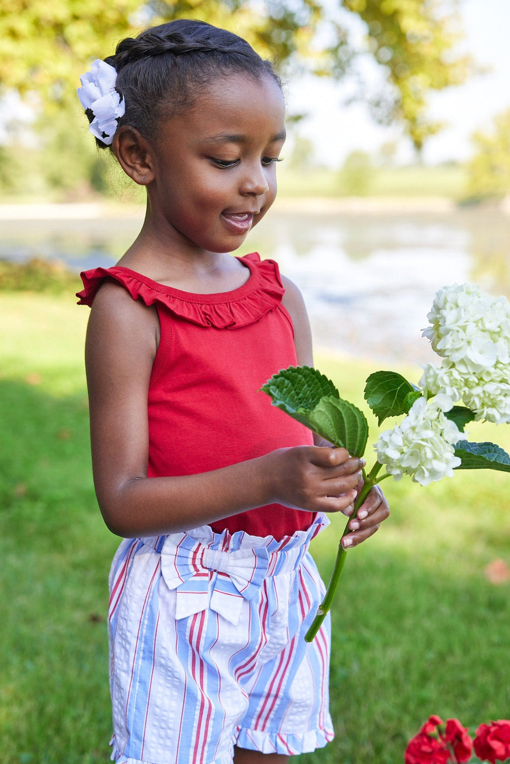 Little English traditional children's clothing.  Red, white and blue striped seersucker shorts for girls for Summer.  4th of July shorts for girls